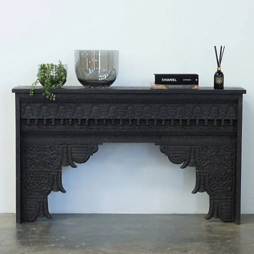 "Elegant console table in a modern living room, styled with decorative accents."