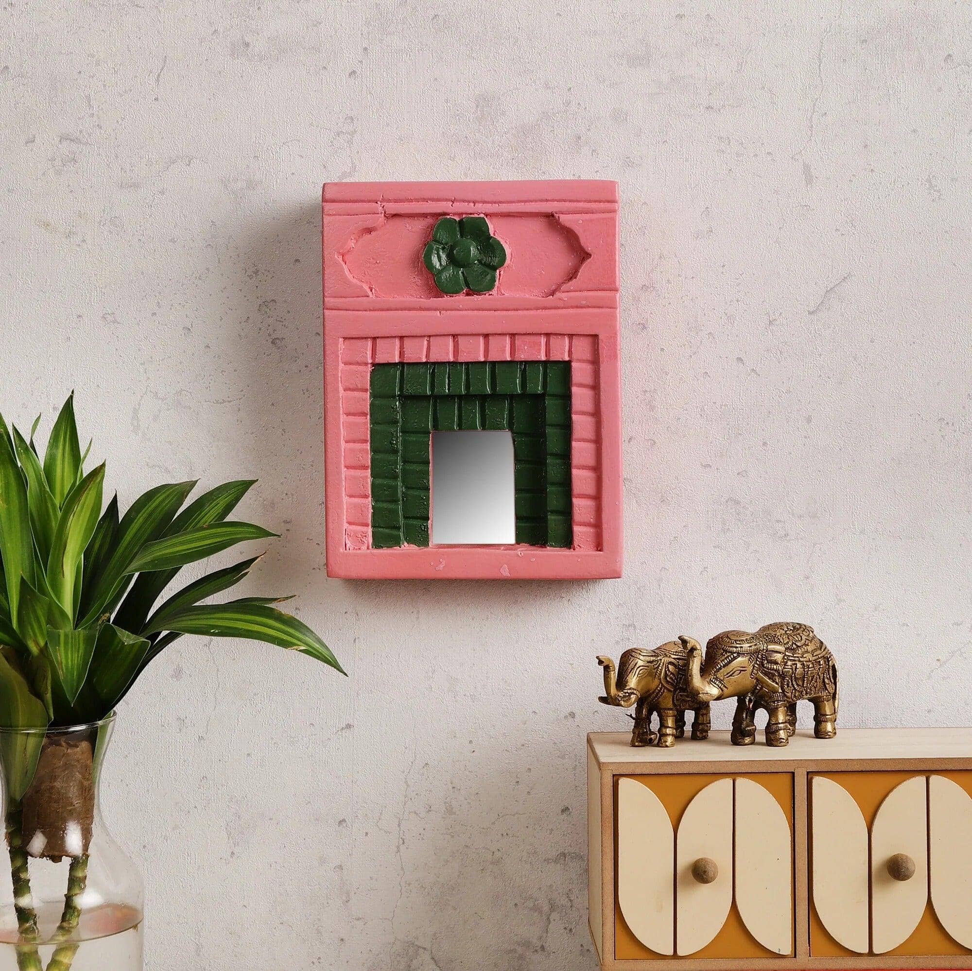 Explore an extensive range of wall mirror designs, including wall mirror designs for living rooms, jharokha mirrors, carved wooden mirror frames, and decorative mirrors. Discover pink mirrors, small decorative mirrors, makeup hand mirrors, and mirror art wall decor to enhance any space. Perfect for bedrooms, bathrooms, and living rooms, our collection includes vintage mirrors, rustic frames, modern jharokhas, and aesthetic wall mirrors. Shop online for wooden jharokhas, carved mirror frames, and unique mirr