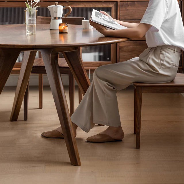 "Solid wood round dining table, perfect for casual and formal settings."
