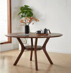 "Elegant round dining table with wooden finish for a cozy dining space."
