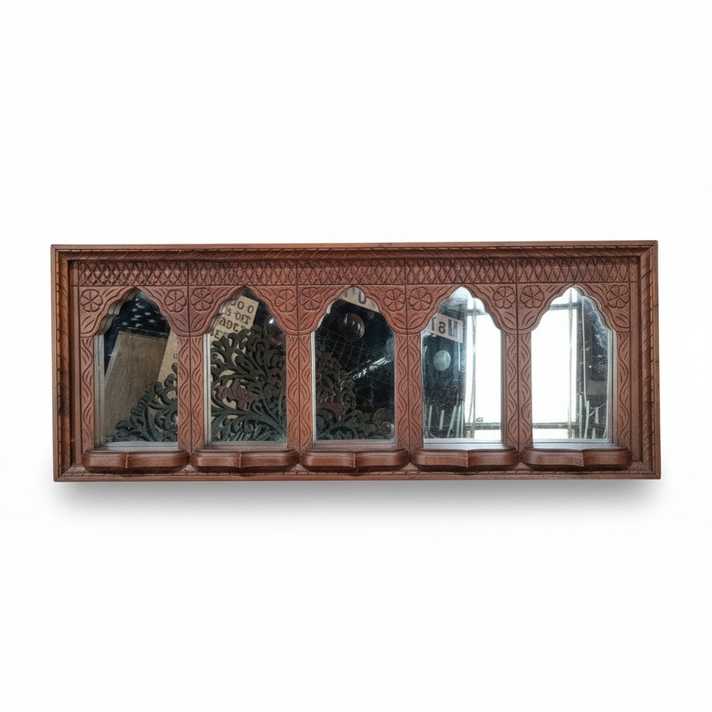 Hand‑carved mango wood jharokha mirror frame, vintage distressed finish, 110 × 30 cm.

