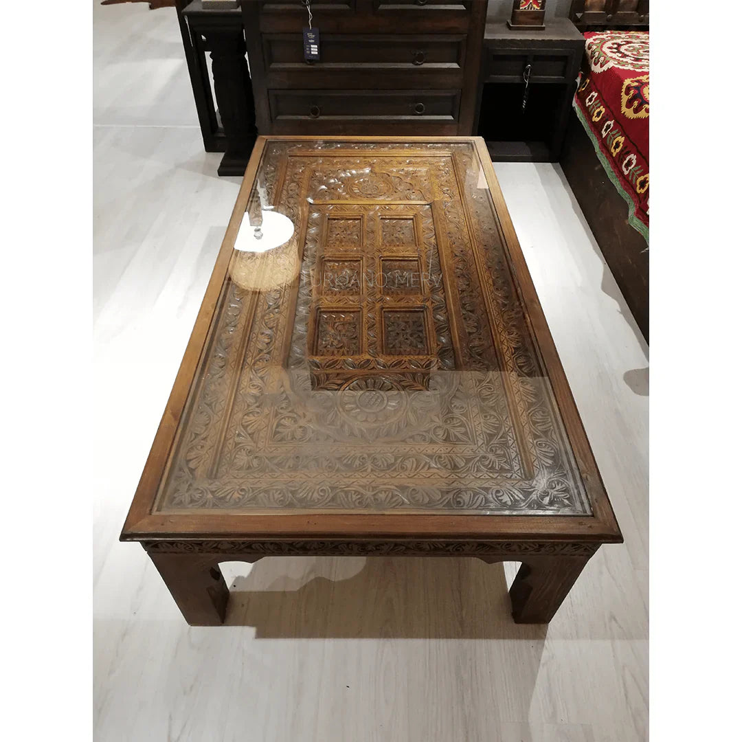 hand carved coffee table, solid wood coffee table, large coffee table, carved wood table, rectangular coffee table, indian furniture, living room table, statement coffee table, handmade coffee table, artisan made table, premium wood table, quality furniture, durable table, sturdy table, timeless table, elegant table, ornate table, unique table, sculptural table, focal piece table, handcrafted in india, sustainable wood furniture, warm wood finish, geometric borders, floral rosettes, scrolling acanthus, six 
