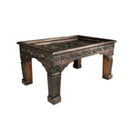 hand carved coffee table, mango wood coffee table, walnut coffee table, carved wood table, rectangular coffee table, indian furniture, living room table, statement coffee table, handmade coffee table, artisan made table, premium wood table, quality furniture, durable table, sturdy table, timeless table, elegant table, ornate table, unique table, sculptural table, focal piece table, handcrafted in india, sustainable mango wood, rich walnut finish, walnut stain, geometric patterns, scrolling vines, scrolling 