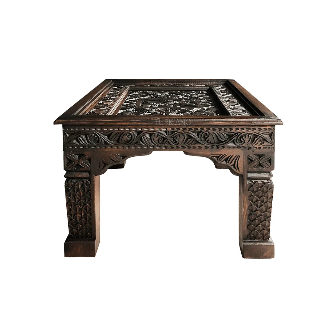 hand carved coffee table, mango wood coffee table, walnut coffee table, carved wood table, rectangular coffee table, indian furniture, living room table, statement coffee table, handmade coffee table, artisan made table, premium wood table, quality furniture, durable table, sturdy table, timeless table, elegant table, ornate table, unique table, sculptural table, focal piece table, handcrafted in india, sustainable mango wood, rich walnut finish, walnut stain, geometric patterns, scrolling vines, scrolling 