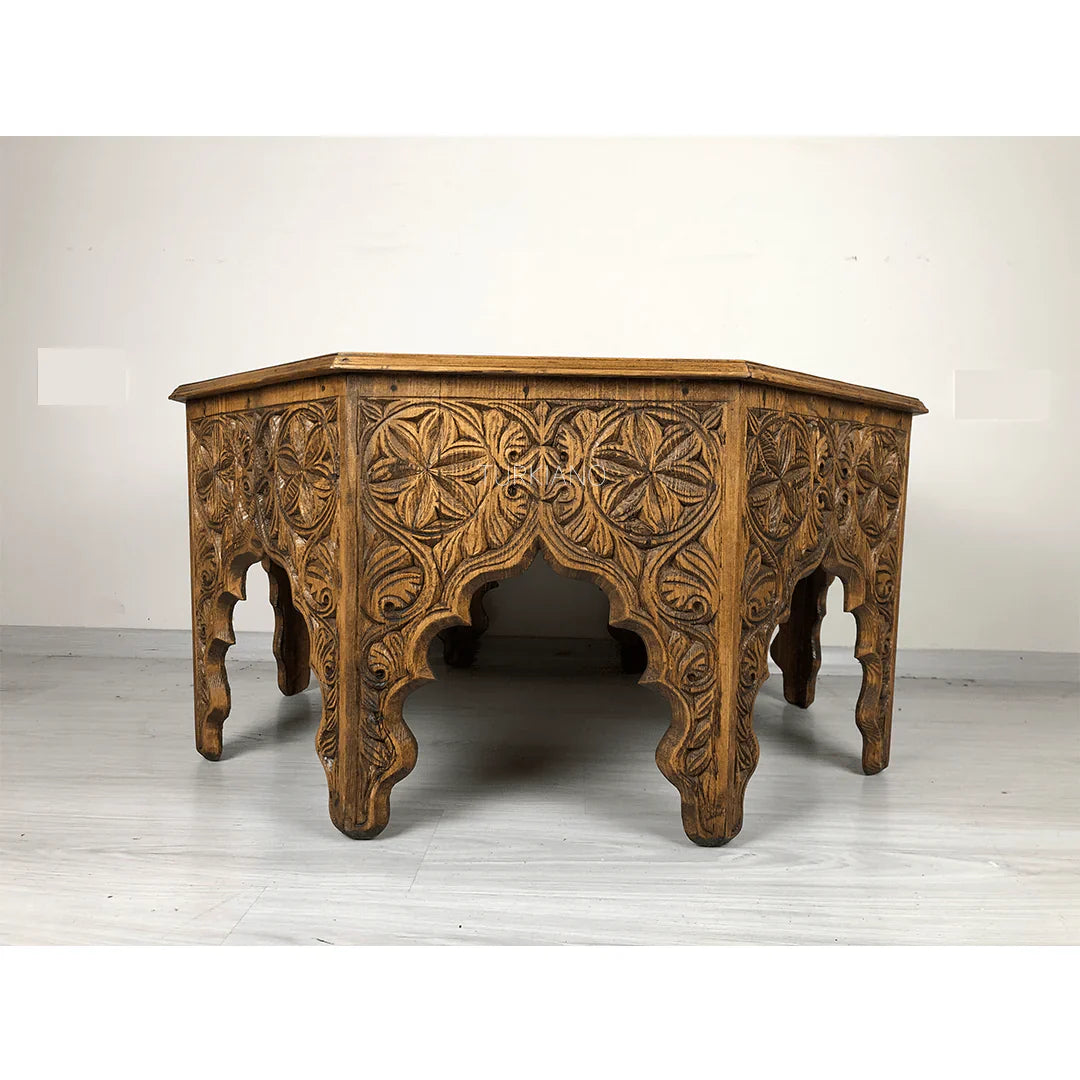 hand carved coffee table, solid wood coffee table, octagonal coffee table, carved wood table, natural wood table, indian furniture, living room table, statement coffee table, mehrab arch table, handmade coffee table, artisan made table, premium wood table, quality furniture, durable table, sturdy table, timeless table, elegant table, ornate table, unique table, sculptural table, focal piece table, handcrafted in india, sustainable wood furniture, star medallion design, geometric patterns, scrolling vines, f