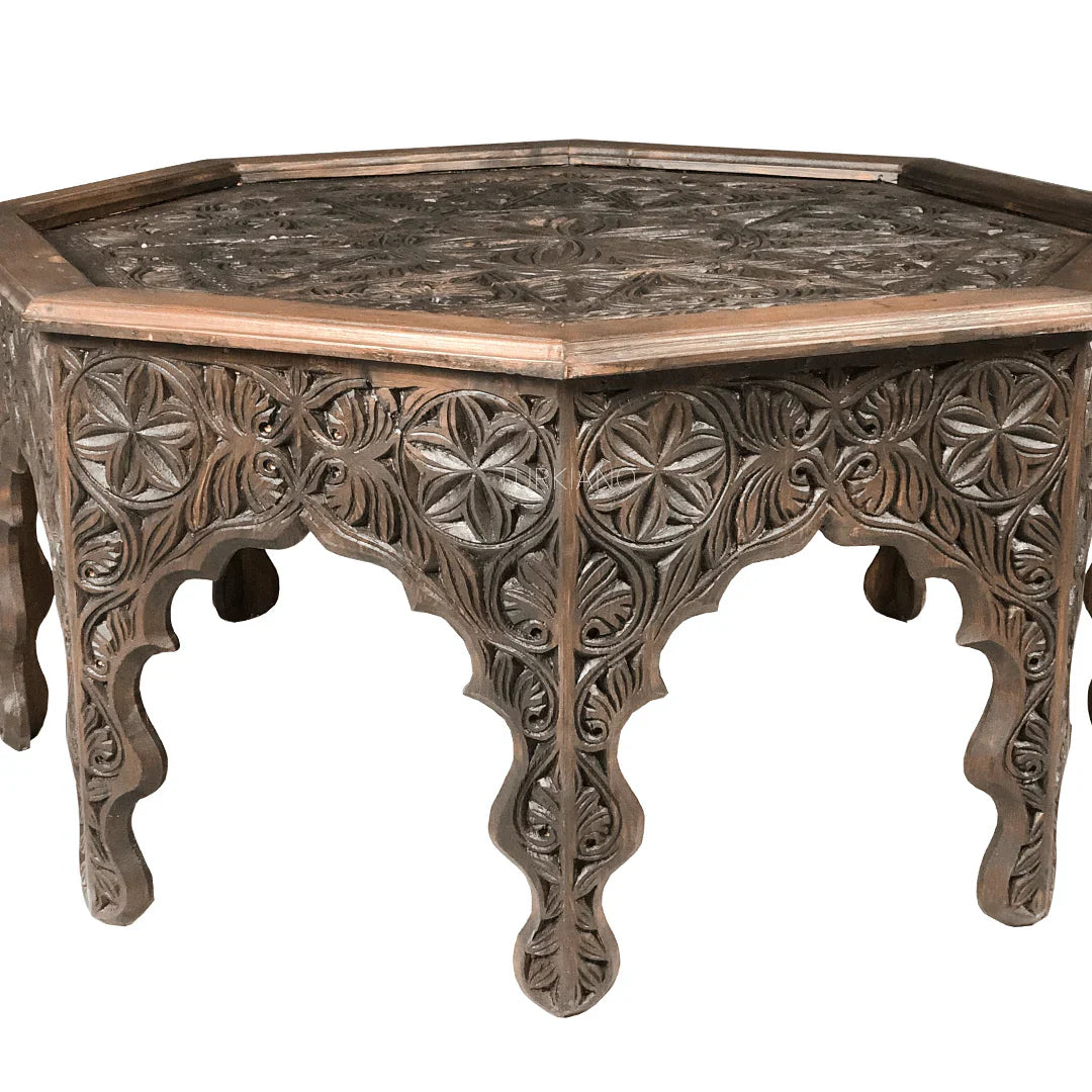hand carved coffee table, solid wood coffee table, octagonal coffee table, carved wood table, indian furniture, living room table, statement coffee table, mehrab arch table, handmade coffee table, artisan made table, premium wood table, quality furniture, durable table, sturdy table, timeless table, elegant table, ornate table, unique table, sculptural table, focal piece table, handcrafted in india, sustainable wood furniture, star medallion design, geometric patterns, scrolling vines, floral rosettes, mehr