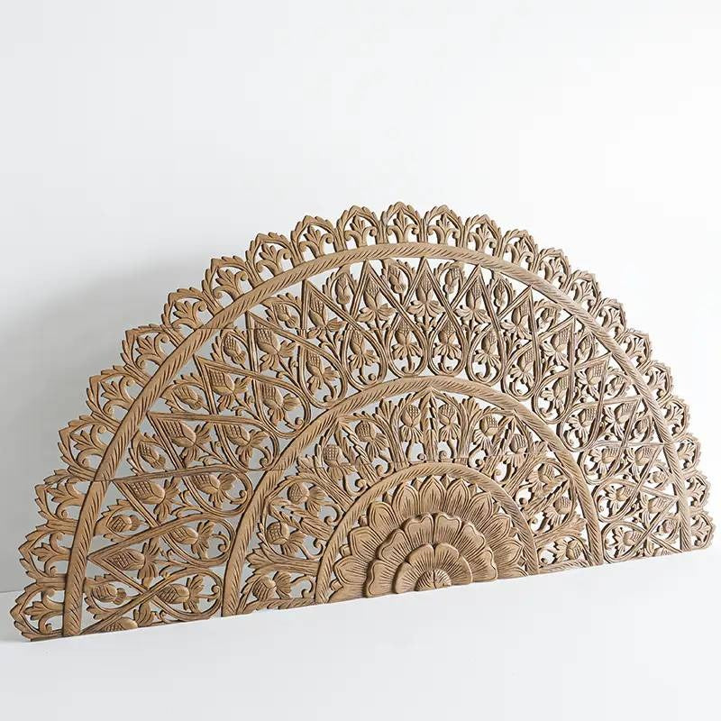 "Round mango wood wall art panel with light walnut finish and hand-carved details"

