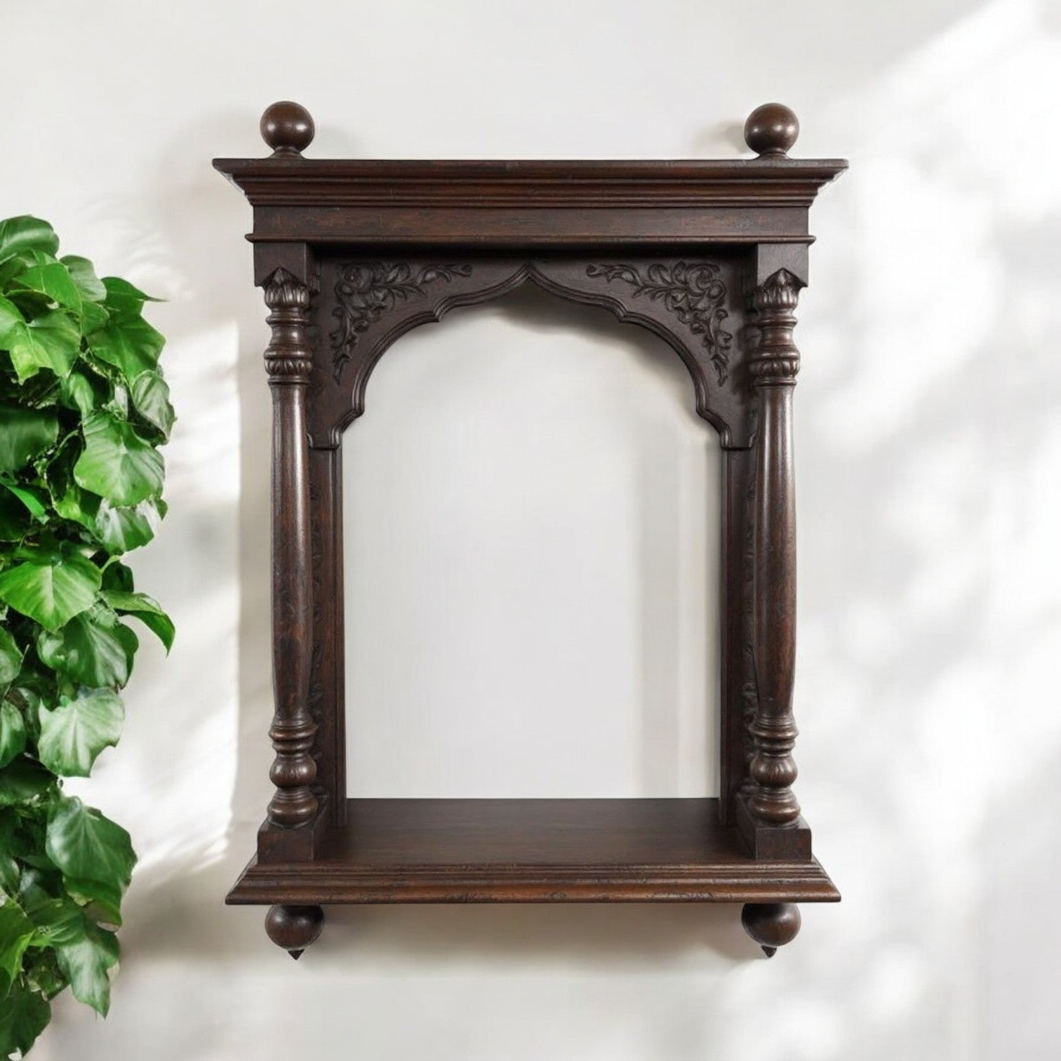 Jodhpur hand-carved archway pooja shelf with dark wood antique wood art finish, featuring columns and finials. Handcrafted in Jodhpur, Rajasthan. Ideal for antique home decor, pooja display, and decorative purposes.