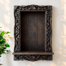 Jodhpur ornate carved wood wall niche shelf with dark antique wood art finish, featuring intricate floral and vine carvings. Handcrafted in Jodhpur, Rajasthan. Ideal for antique home decor and decorative display.