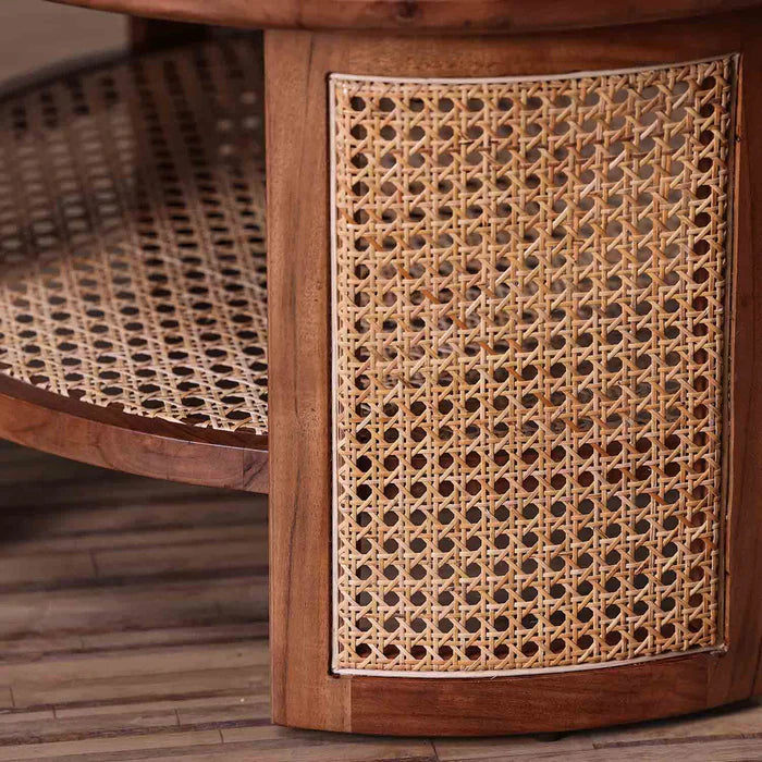 rattan coffee table, acacia wood coffee table, cane coffee table, round coffee table, woven rattan table, walnut coffee table, coastal coffee table, mid century table, bohemian table, indian furniture, living room table, statement coffee table, handmade coffee table, artisan made table, premium wood table, quality furniture, durable table, sturdy table, timeless table, elegant table, unique table, sculptural table, focal piece table, handcrafted in india, sustainable acacia wood, natural rattan, woven cane,