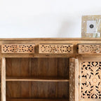 hand carved sideboard, mango wood sideboard, natural finish sideboard, floral carved sideboard, openwork sideboard, 3 door sideboard, 3 drawer sideboard, buffet sideboard, indian carved furniture, storage sideboard, dining room buffet, living room sideboard, entryway sideboard, statement sideboard, medium sideboard, handmade sideboard, artisan made sideboard, premium wood buffet, quality wood furniture, durable sideboard, sturdy buffet, timeless sideboard, elegant buffet, heirloom buffet, rustic sideboard, 
