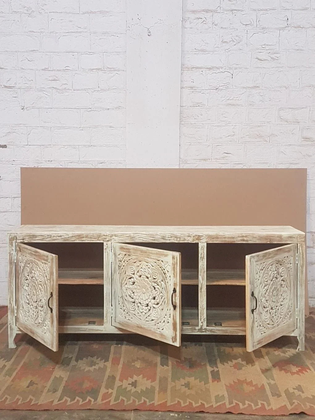 Statement buffet with openwork lattice panels and distressed whitewash patina.

