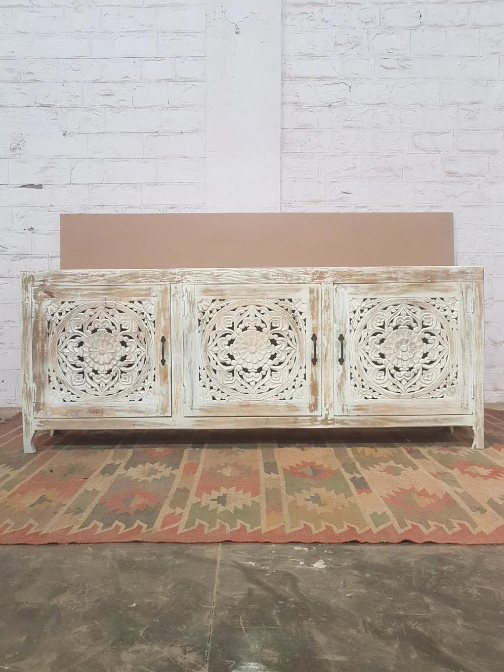 Large 3‑door sideboard with mandala medallion carving, coastal shabby‑chic style.

