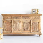 hand carved sideboard, mango wood sideboard, natural finish sideboard, floral carved sideboard, 4 door sideboard, 4 drawer sideboard, buffet sideboard, indian carved furniture, storage sideboard, dining room buffet, living room sideboard, entryway sideboard, statement sideboard, large sideboard, handmade sideboard, artisan made sideboard, premium wood buffet, quality wood furniture, durable sideboard, sturdy buffet, timeless sideboard, elegant buffet, grand sideboard, heirloom buffet, rustic sideboard, trad