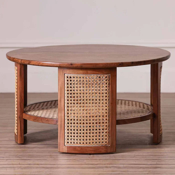 rattan coffee table, acacia wood coffee table, cane coffee table, round coffee table, woven rattan table, walnut coffee table, coastal coffee table, mid century table, bohemian table, indian furniture, living room table, statement coffee table, handmade coffee table, artisan made table, premium wood table, quality furniture, durable table, sturdy table, timeless table, elegant table, unique table, sculptural table, focal piece table, handcrafted in india, sustainable acacia wood, natural rattan, woven cane,