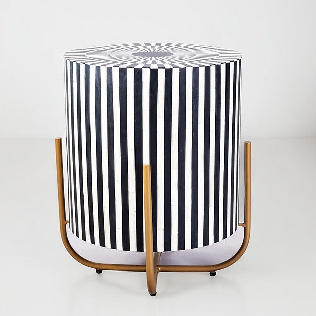 "Round side table with a sleek gold finish for a luxurious touch."
