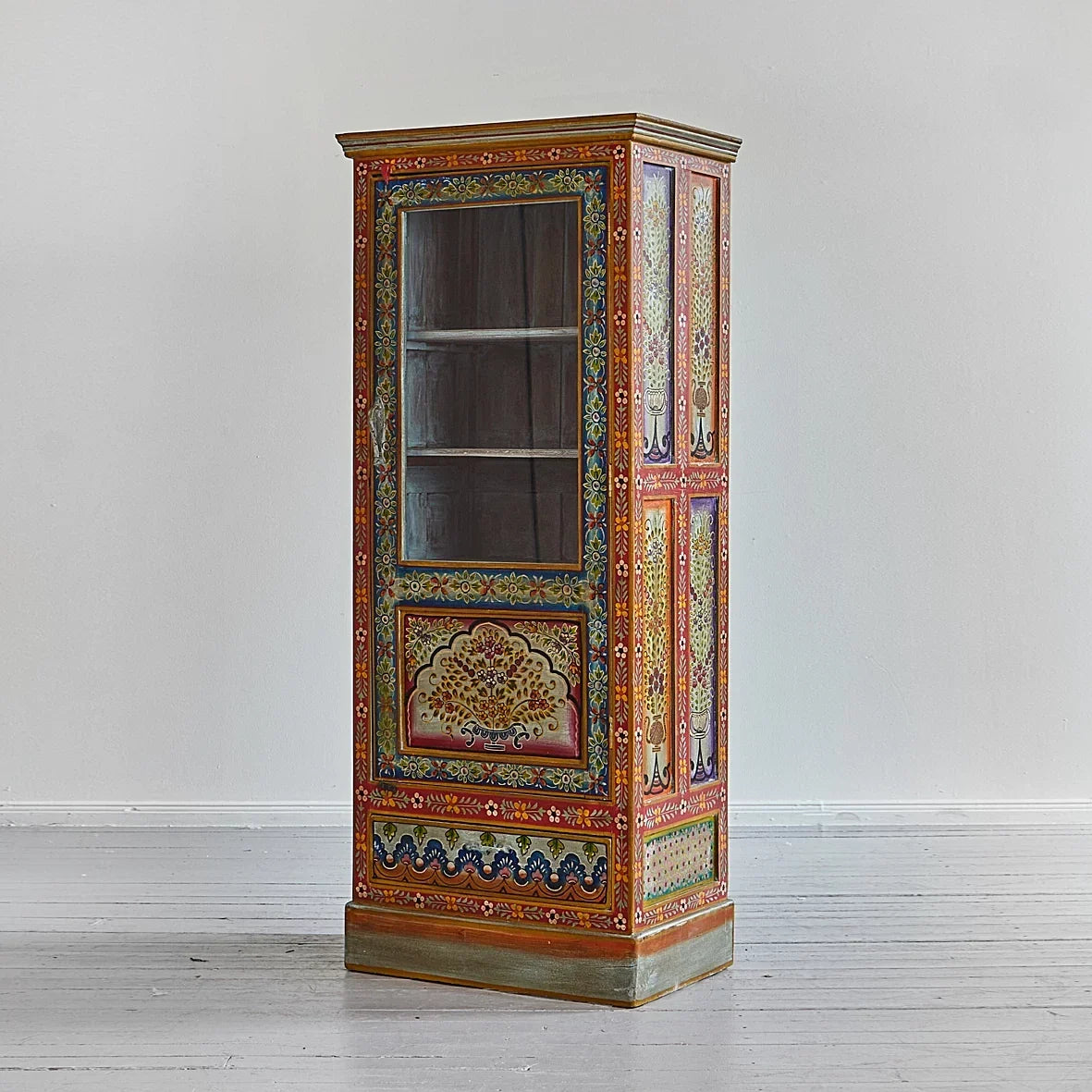 Decorative cabinet with intricate patterns on a plain background