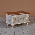 Vintage‑style storage trunk on turned legs, lift‑top design.

