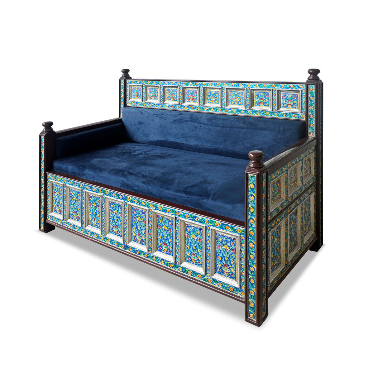 Decorative bed with blue cushion and ornate wooden frame on a white background