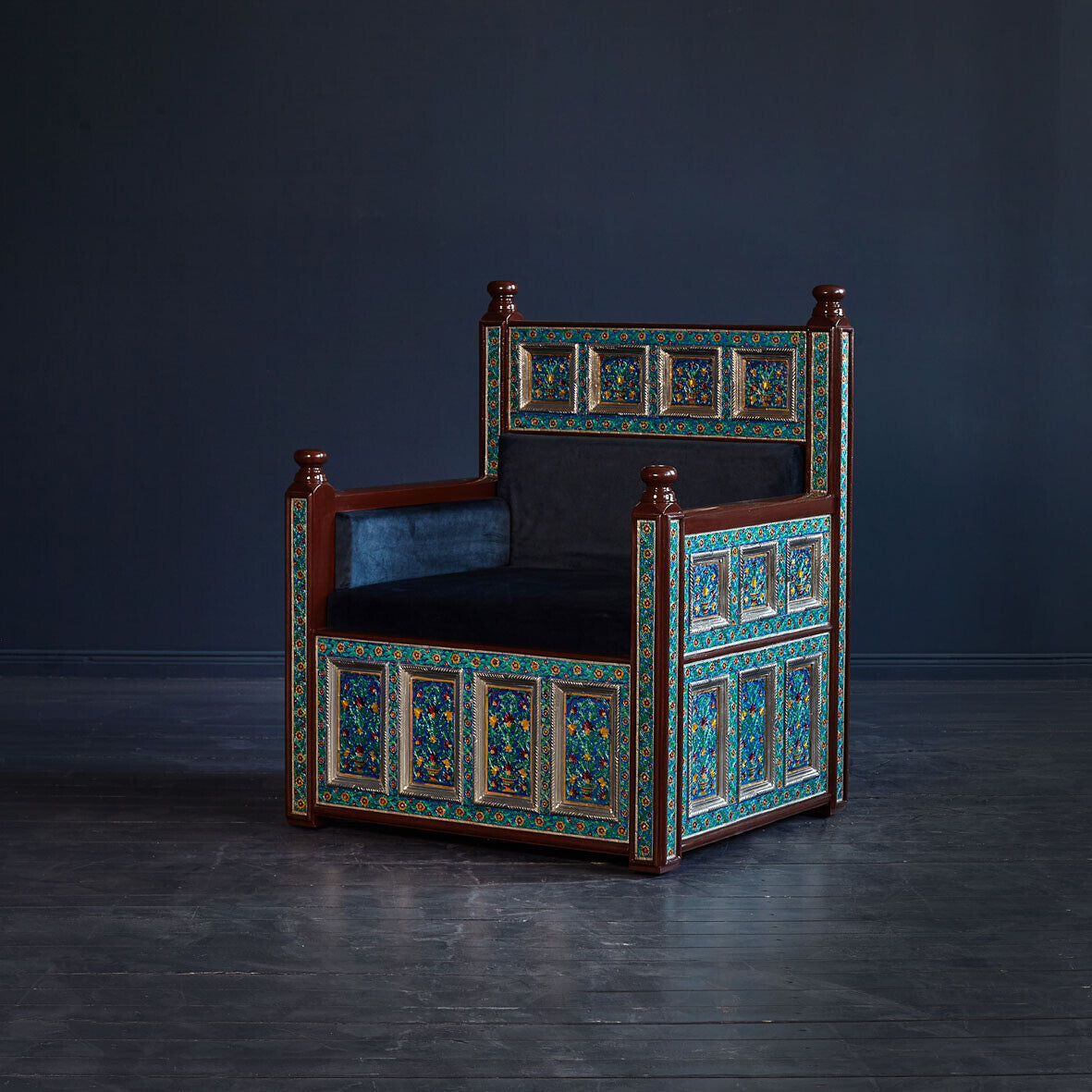 Front view of a royal Marrakesh blue embossed armchair with plush navy seating.