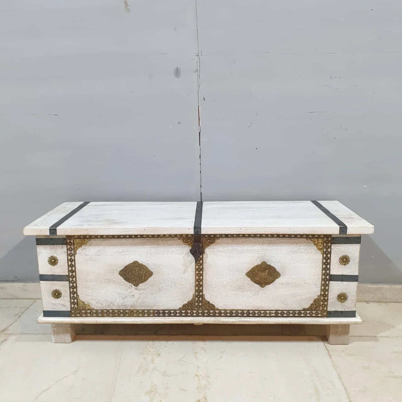 hand carved blanket box, wooden trunk, whitewashed blanket box, brass fittings box, brass medallion trunk, blanket trunk, linen chest, indian furniture, bedroom blanket box, living room trunk, entryway chest, storage bench, coffee table trunk, handmade blanket box, artisan made trunk, premium wood chest, quality wood furniture, durable trunk, sturdy blanket box, timeless chest, elegant trunk, statement blanket box, heirloom chest, mughal style trunk, vintage blanket box, eclectic chest, coastal trunk, rusti
