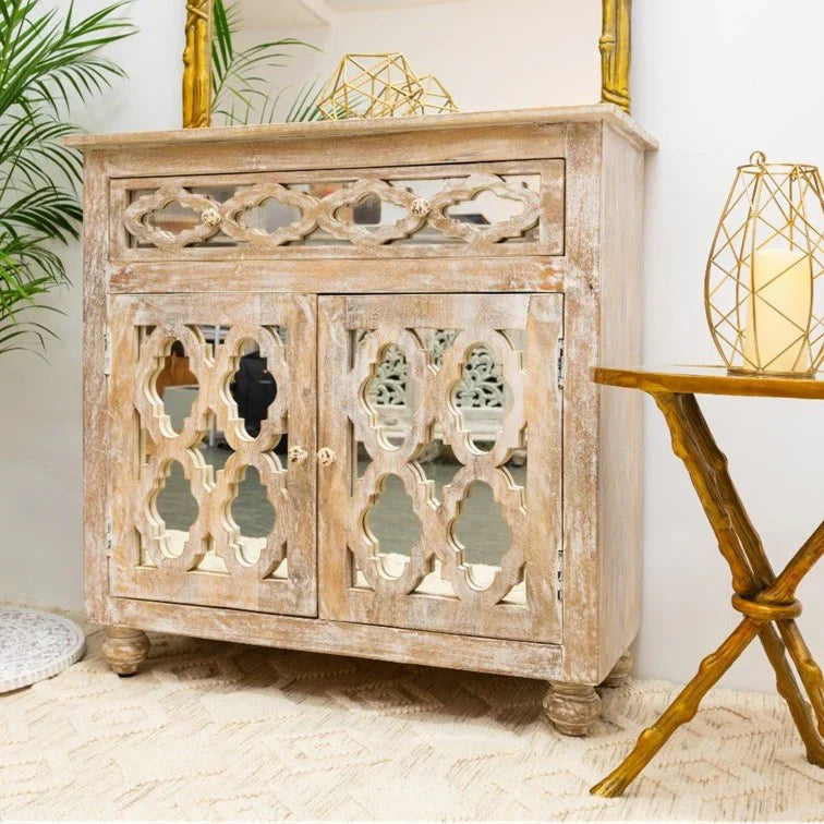 hand carved cabinet, mango wood cabinet, distressed cabinet, 1 drawer cabinet, 2 door cabinet, moroccan style cabinet, lattice carved cabinet, openwork cabinet, indian carved furniture, storage cabinet, dining room cabinet, living room cabinet, bedroom cabinet, entryway cabinet, accent cabinet, statement cabinet, compact cabinet, handmade cabinet, artisan made cabinet, premium wood cabinet, quality wood furniture, durable cabinet, sturdy cabinet, timeless cabinet, elegant cabinet, heirloom cabinet, global s