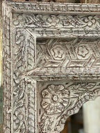 mango wood mirror, carved mirror, mehrab mirror, arched mirror, islamic mirror, moroccan mirror, distressed mirror, white mirror, rustic mirror, antique mirror, wall mirror, statement mirror, architectural mirror, jali mirror, mughal mirror, traditional mirror, handmade mirror, artisan mirror, premium mirror, quality mirror, durable mirror, elegant mirror, unique mirror, decorative mirror, focal piece mirror, handcrafted in india, sustainable mango wood, distressed white, white finish, rustic antiquing, war