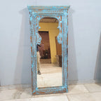 hand carved mirror, wooden frame mirror, rustic blue mirror, turquoise mirror, distressed blue mirror, full length mirror, wall mirror, mehrab arch mirror, arched mirror, entryway mirror, narrow mirror, dressing mirror, decorative mirror, indian furniture, handmade mirror, artisan made mirror, premium wood mirror, quality mirror, durable mirror, sturdy mirror, timeless mirror, elegant mirror, statement mirror, ornate mirror, unique mirror, sculptural mirror, focal piece mirror, handcrafted in india, sustain