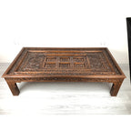hand carved coffee table, solid wood coffee table, large coffee table, carved wood table, rectangular coffee table, indian furniture, living room table, statement coffee table, handmade coffee table, artisan made table, premium wood table, quality furniture, durable table, sturdy table, timeless table, elegant table, ornate table, unique table, sculptural table, focal piece table, handcrafted in india, sustainable wood furniture, warm wood finish, geometric borders, floral rosettes, scrolling acanthus, six 