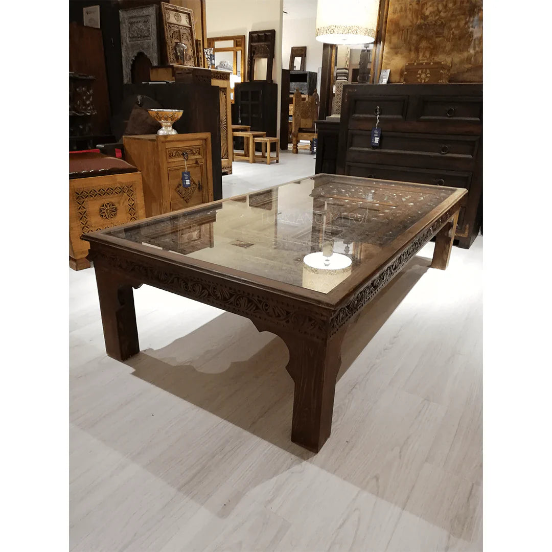 hand carved coffee table, solid wood coffee table, large coffee table, carved wood table, rectangular coffee table, indian furniture, living room table, statement coffee table, handmade coffee table, artisan made table, premium wood table, quality furniture, durable table, sturdy table, timeless table, elegant table, ornate table, unique table, sculptural table, focal piece table, handcrafted in india, sustainable wood furniture, warm wood finish, geometric borders, floral rosettes, scrolling acanthus, six 
