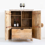 hand carved bar cabinet, mango wood bar cabinet, bar cabinet on stand, metal stand cabinet, sunburst carved cabinet, natural finish cabinet, wine cabinet, liquor cabinet, home bar cabinet, dining room bar cabinet, living room bar cabinet, storage cabinet, 2 door cabinet, drawer cabinet, handmade bar cabinet, artisan made cabinet, premium wood cabinet, quality wood furniture, durable bar cabinet, sturdy cabinet, timeless bar cabinet, elegant cabinet, statement bar cabinet, industrial style cabinet, modern ba