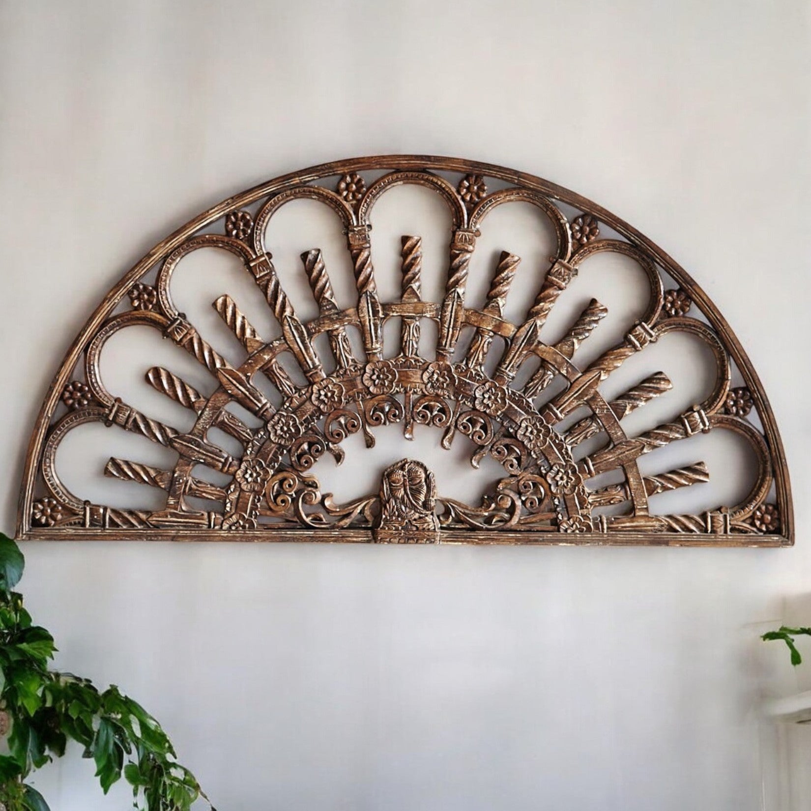 Close-up of traditional carvings on 183cm wide wooden wall decor
