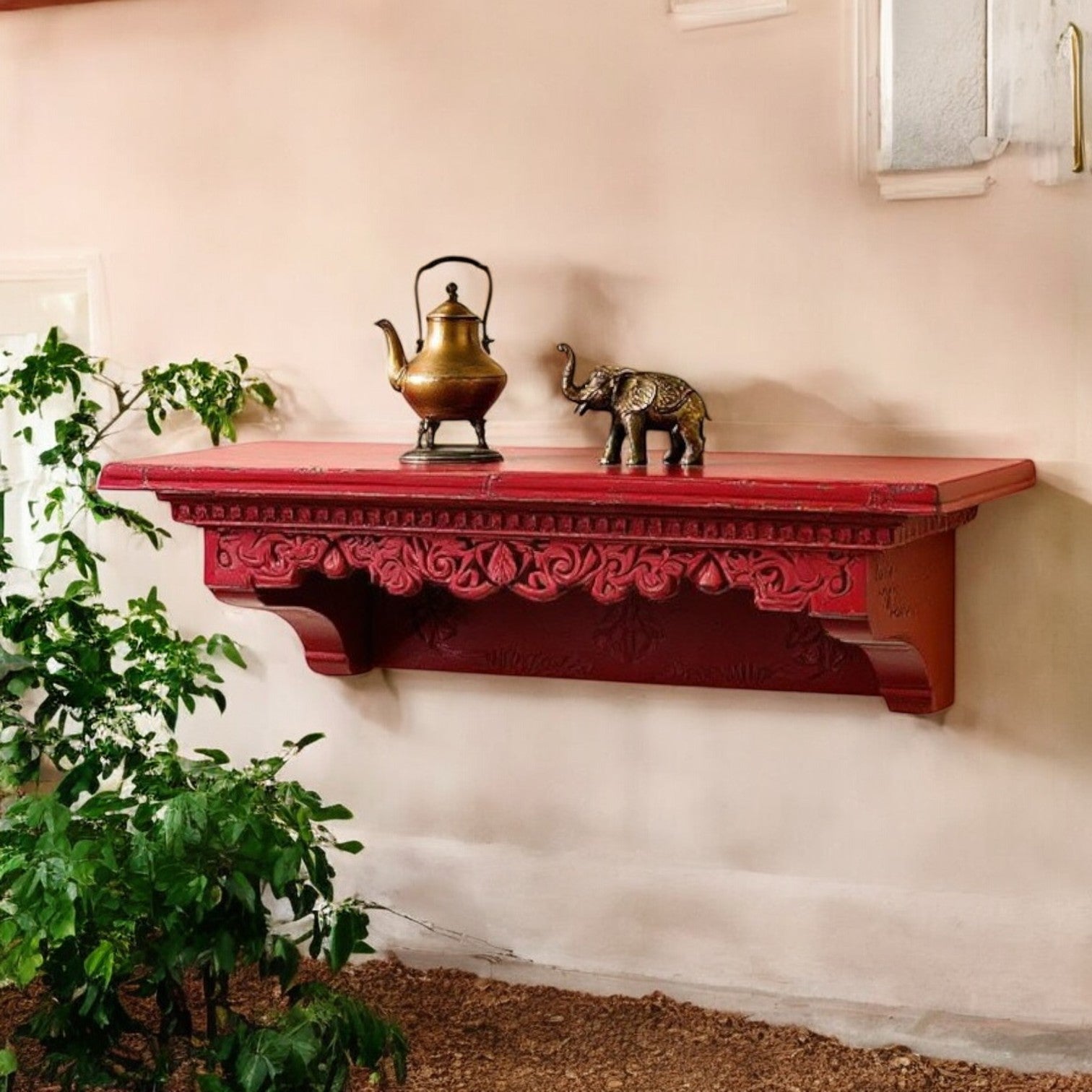 Ethnic living room with large carved wall shelf above a velvet sofa