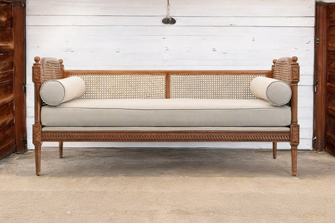 CARVED CANE SOFA