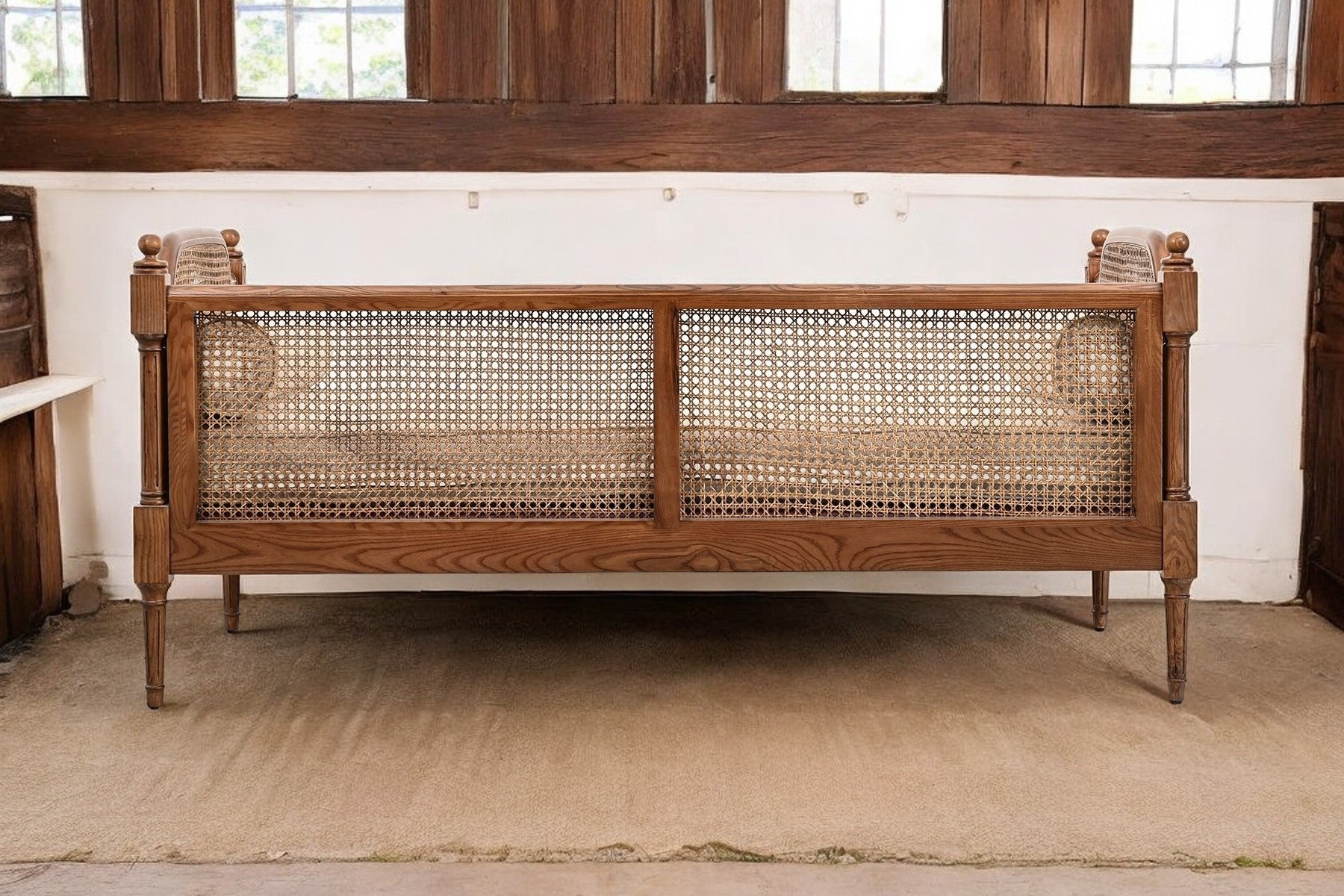 CARVED CANE SOFA
