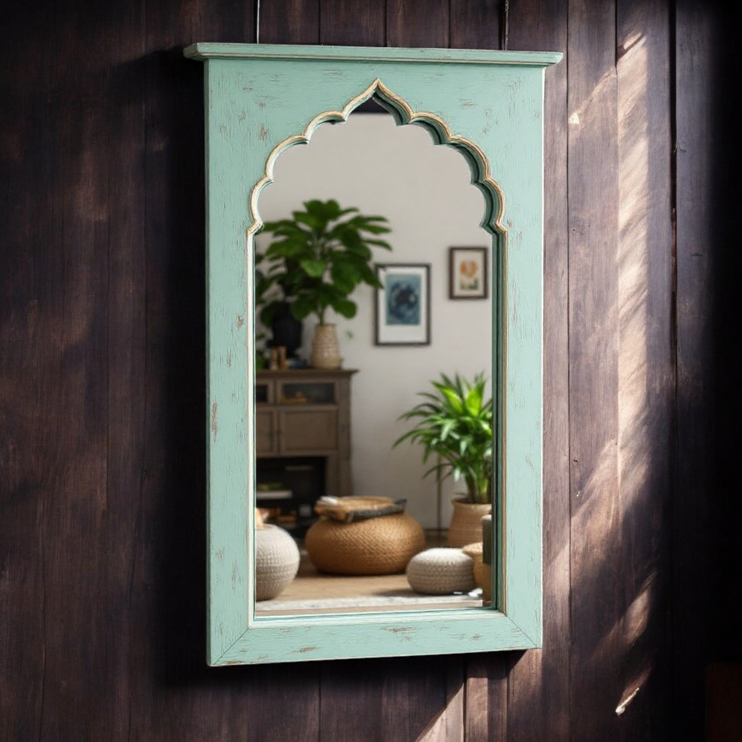 "Vintage Jharokha wall mirror with a Moroccan arch design and distressed mint green frame, reflecting a living room interior."
