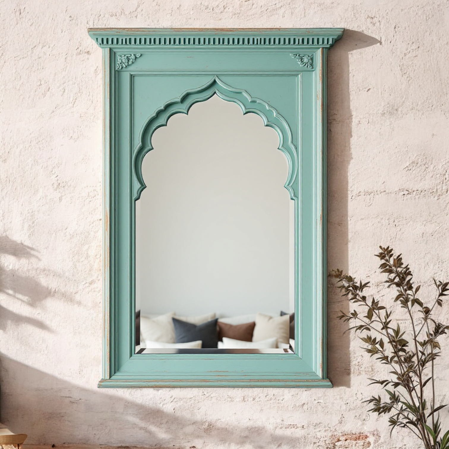 "Jodhpur carved wooden Jharokha mirror with a distressed mint green frame, reflecting a living room interior."

