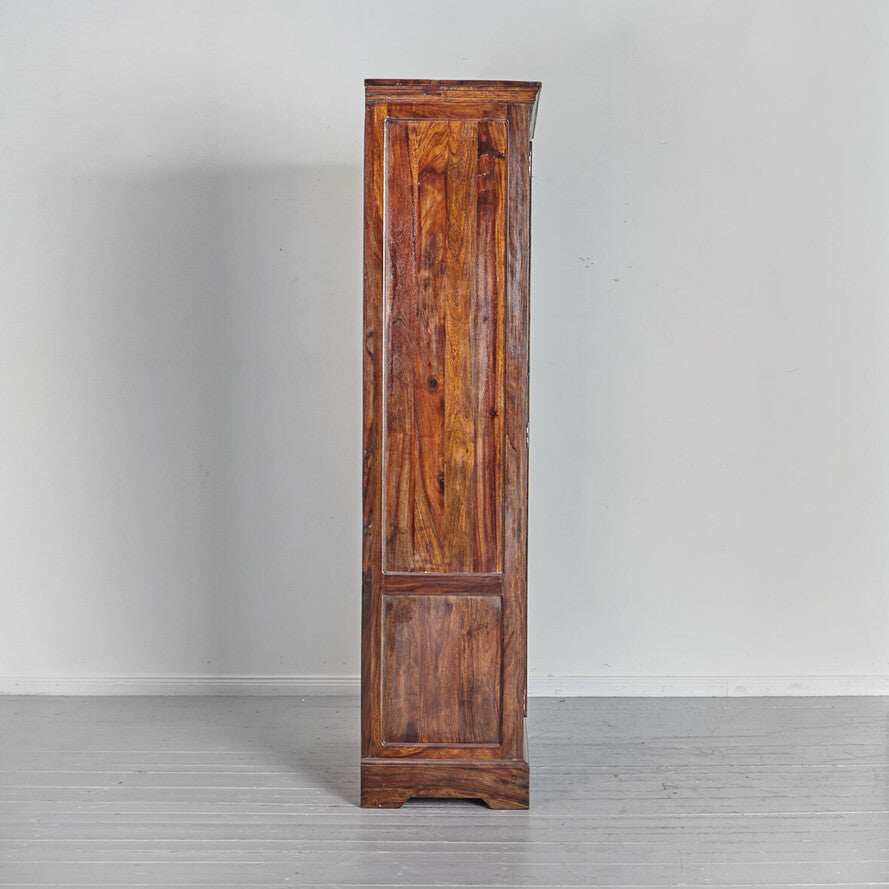 Wooden cabinet with a rustic finish on a plain background