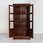 Wooden bookshelf with glass doors on a white background