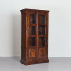 Wooden cabinet with glass doors on a white background