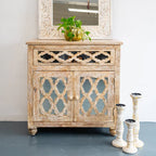 hand carved cabinet, mango wood cabinet, distressed cabinet, 1 drawer cabinet, 2 door cabinet, moroccan style cabinet, lattice carved cabinet, openwork cabinet, indian carved furniture, storage cabinet, dining room cabinet, living room cabinet, bedroom cabinet, entryway cabinet, accent cabinet, statement cabinet, compact cabinet, handmade cabinet, artisan made cabinet, premium wood cabinet, quality wood furniture, durable cabinet, sturdy cabinet, timeless cabinet, elegant cabinet, heirloom cabinet, global s