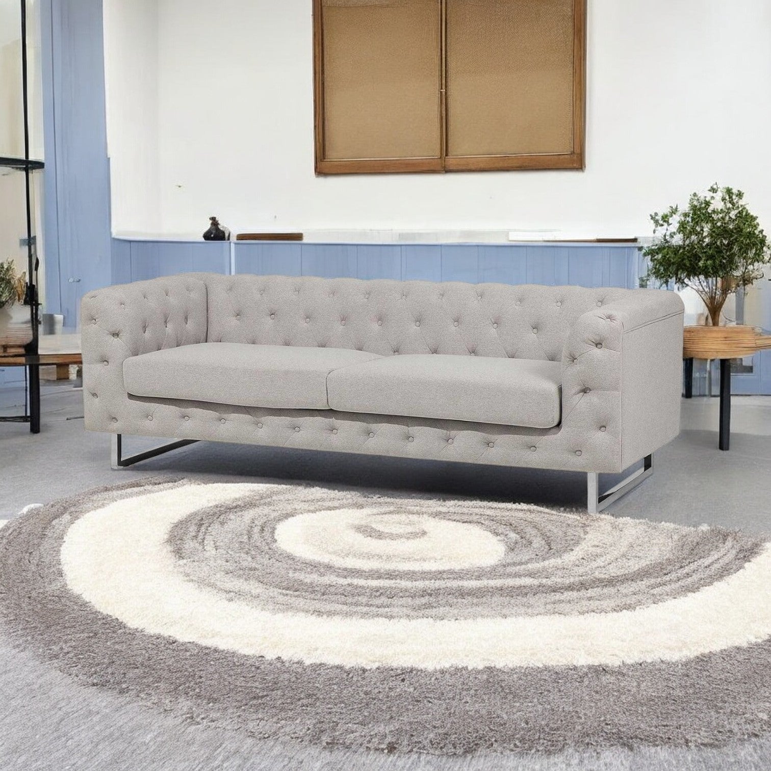 "Elegant three seater sofa in a modern living room setting."
