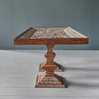 Premium mango wood dining table, handcrafted with intricate carving, farmhouse style.

