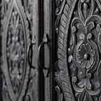 Close-up of ornate HANDCARVED work with intricate patterns