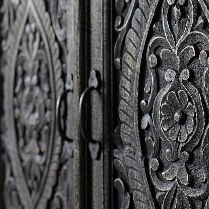 Close-up of ornate HANDCARVED work with intricate patterns