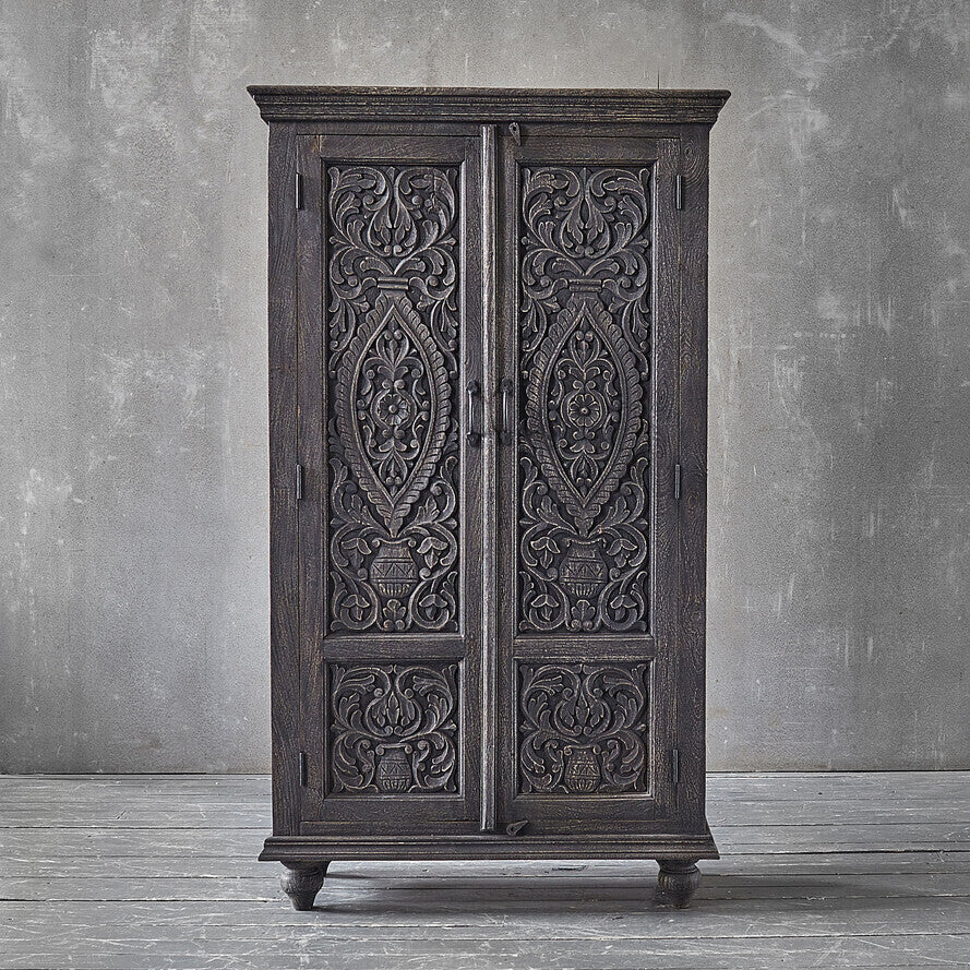 Hand‑carved mango wood wardrobe in antique grey, floral carved doors, 164 × 97 × 43 cm.

