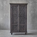 Hand‑carved mango wood wardrobe in antique grey, floral carved doors, 164 × 97 × 43 cm.

