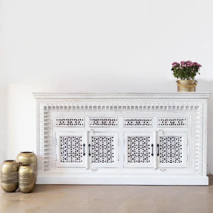 hand carved sideboard, mango wood sideboard, distressed white sideboard, floral carved sideboard, openwork sideboard, 4 door sideboard, 4 drawer sideboard, buffet sideboard, indian carved furniture, storage sideboard, dining room buffet, living room sideboard, entryway sideboard, statement sideboard, large sideboard, handmade sideboard, artisan made sideboard, premium wood buffet, quality wood furniture, durable sideboard, sturdy buffet, timeless sideboard, elegant buffet, grand sideboard, heirloom buffet, 