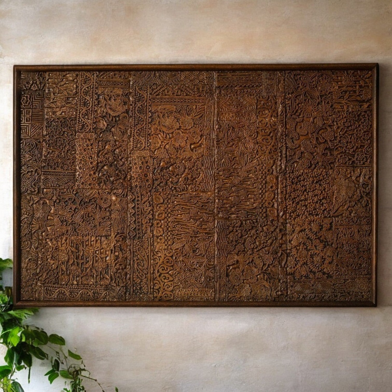 Ornamental carved wooden panel featuring intricate floral and geometric designs.

