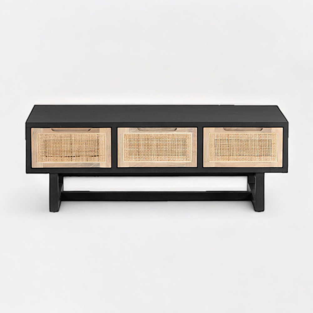 Dark wood coffee table in a contemporary living room with bold decorative elements.
